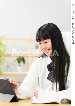 High school girl studying tablet 114677172