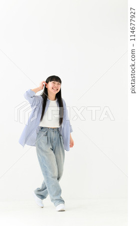 Casually dressed high school girl portrait vertical 114677927
