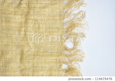 torn sackcloth isolated on white background, burlap fabric texture for design 114678476