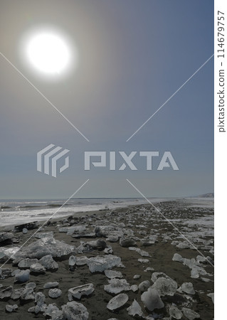 A view of jewelry ice on Otsu Coast with the big sun shining A view of jewelry ice on Otsu Coast with the big sun shining 114679757