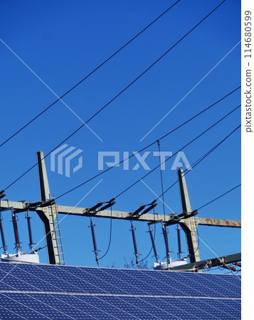 A power line with a blue sky in the background A power line with a blue sky in the background 114680599