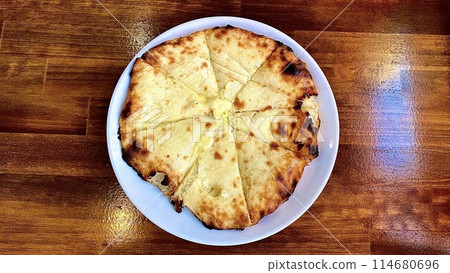 Indian Nepalese garlic cheese naan Indian Nepalese garlic cheese naan 114680696