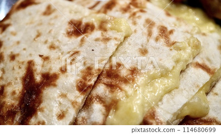Close-up of Indian-Nepalese cheese naan Close-up of Indian-Nepalese cheese naan 114680699