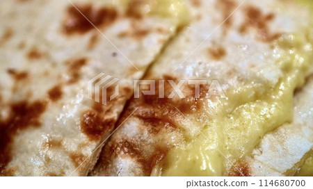 Close-up of Indian-Nepalese cheese naan Close-up of Indian-Nepalese cheese naan 114680700