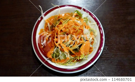 Salad with Indian/Nepalese dressing Salad with Indian/Nepalese dressing 114680701