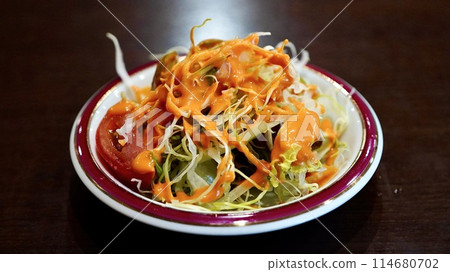 Salad with Indian/Nepalese dressing Salad with Indian/Nepalese dressing 114680702