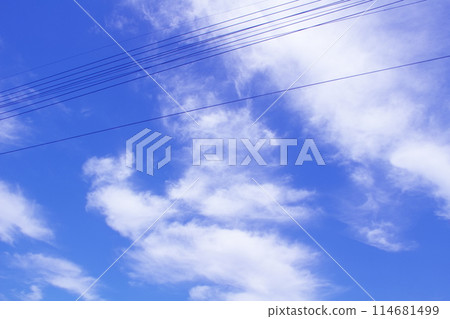 Power lines reflected in the refreshing blue sky and white clouds of May Power lines reflected in the refreshing blue sky and white clouds of May 114681499