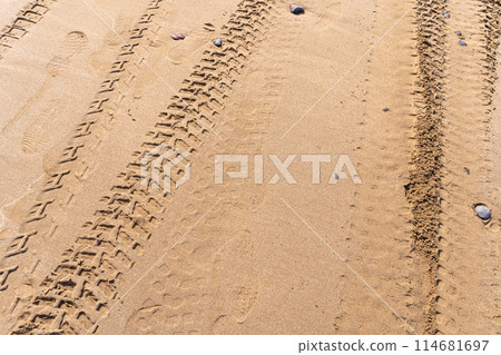 Wheel Tracks on Beach Texture Background, Sand and Rocky Pattern, Red Morocco Beach Wheel Tracks on Beach Texture Background, Sand and Rocky Pattern, Red Morocco Beach 114681697