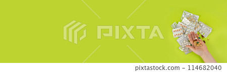 Hand with Color Pill Capsules on Green Background, Overdose Concept, Opioid Problem, Poison, Analgesic 114682040