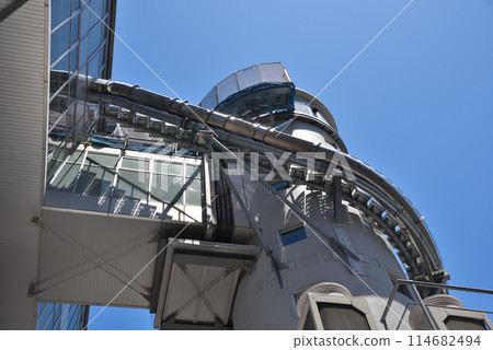 The exterior of the Tower Slider, an experiential attraction at Tsutenkaku, a symbol of Osaka Shinsekai The exterior of the Tower Slider, an experiential attraction at Tsutenkaku, a symbol of Osaka Shinsekai 114682494