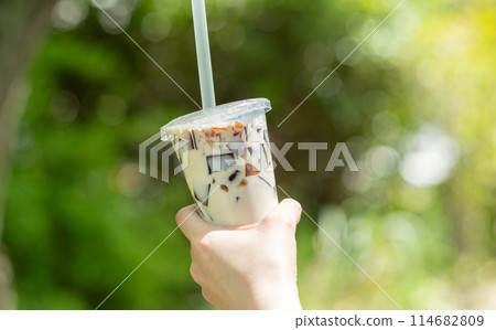 Drinking coffee outdoors Drinking coffee outdoors 114682809