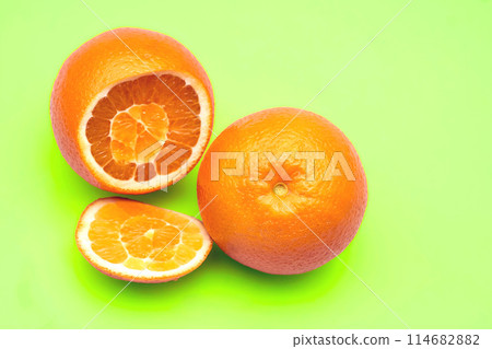 Juicy sliced oranges on green. Ready to eat,drink and cook 114682882