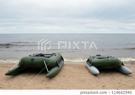 Rubber boats on lake shore. 114682940