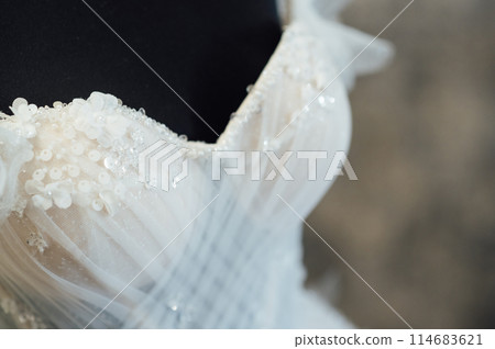 White wedding dress on a black dummy before the bride puts it on 114683621