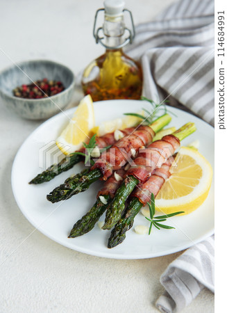 Asparagus baked with bacon Asparagus baked with bacon 114684991