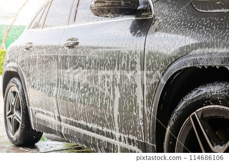 car cleaning and washing with foam soap 114686106