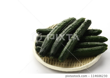 Cucumber on a colander (white background) 114686230