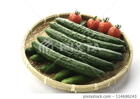 Cucumber and tomato on a colander (white background) 114686243