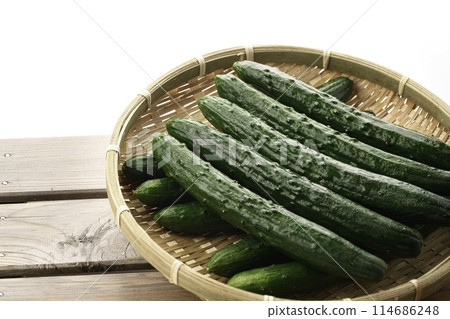 Cucumber on a colander (white background) Cucumber on a colander (white background) 114686248
