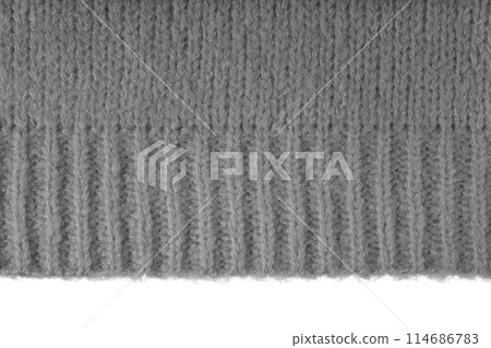 Gray knitted woolen jersey fabric, sweater texture with edge isolated on white background Gray knitted woolen jersey fabric, sweater texture with edge isolated on white background 114686783