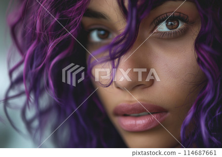 Intimate close up of a woman with deep purple curls 114687661