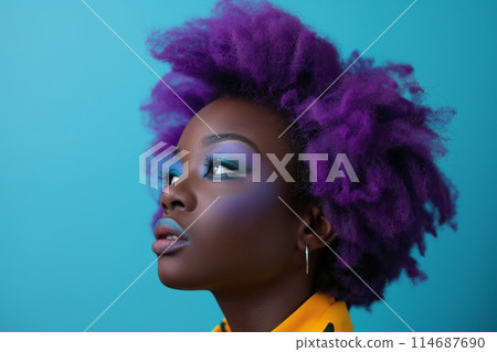 Woman with voluminous purple afro and vibrant eye makeup against a contrasting blue backdrop 114687690