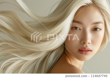 An ethereal beauty with flowing blonde hair and piercing eyes in a minimalist style 114687740