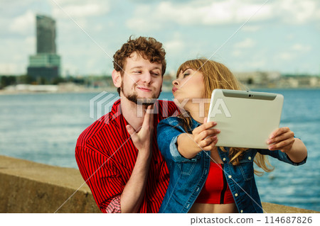 Young couple taking self picture selfie with tablet 114687826
