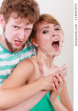 Angry man strangling screaming woman, violence 114687874
