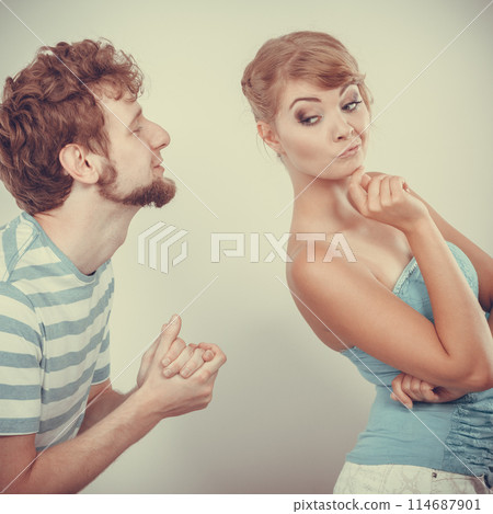 Man asking for forgivness. Conflicted couple. 114687901