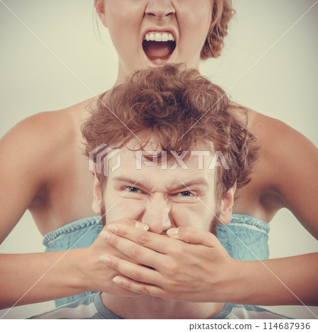 fury woman screaming while covering mouth her man 114687936