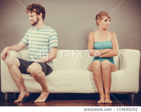 Man and woman in disagreement sitting on sofa 114688202