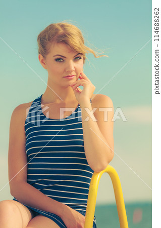 Fashion woman in striped dress outdoor. Summer. 114688262