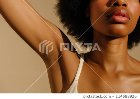 A young African American woman shows her shaved armpit. Body care concept 114688926
