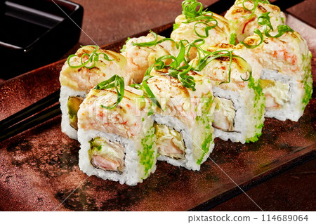 Uramaki sushi rolls with green tobiko, shrimp and cream cheese Uramaki sushi rolls with green tobiko, shrimp and cream cheese 114689064