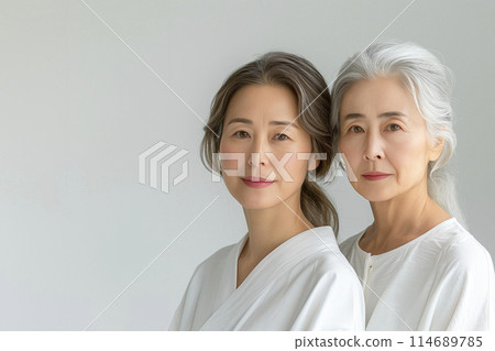Portrait of a middle-aged woman and her mother on a white background AI-generated image Portrait of a middle-aged woman and her mother on a white background AI-generated image 114689785