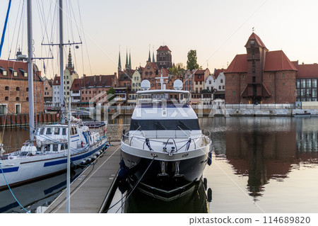 Luxury super yacht moored in Gdansk old city. Motor yacht. Beautiful view of Gdansk, Poland. 114689820