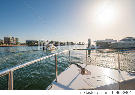 Sunny day on a yacht near Al Raha Sunny day on a yacht near Al Raha 114690404