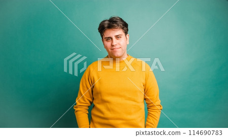 Smiling man in green studio Smiling man in green studio 114690783