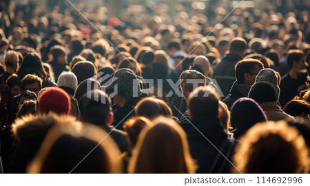 Crowded scene of people in coats. 114692996
