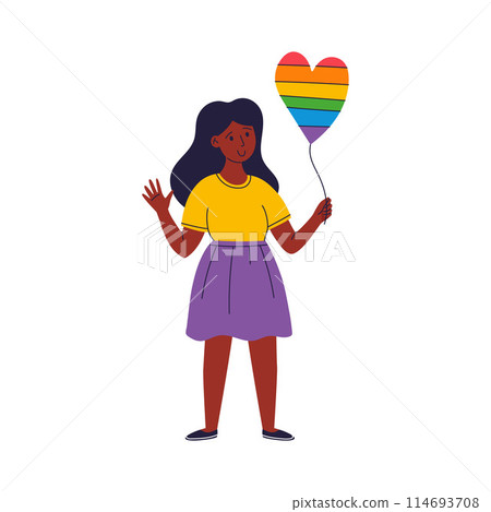 A young woman is holding a rainbow-colored heart balloon A young woman is holding a rainbow-colored heart balloon 114693708