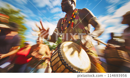 a festival-goer reveling in the vibrant energy of a drum circle, their hands beating out a rhythmic cadence 114693956