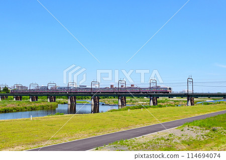 Keio Train across the Tama River Keio Train across the Tama River 114694074