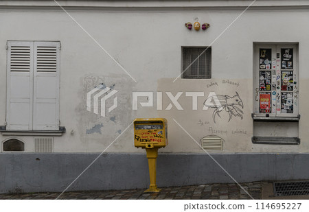 Shutters and windows with small peephole on old wall of a ground floor residence and Post box. Shutters and windows with small peephole on old wall of a ground floor residence and Post box. 114695227