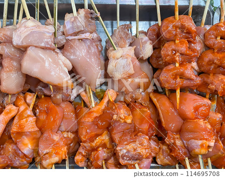 Typical Asian street food to choose from for grilling. Raw chicken, pork, liver on bamboo skewers Typical Asian street food to choose from for grilling. Raw chicken, pork, liver on bamboo skewers 114695708