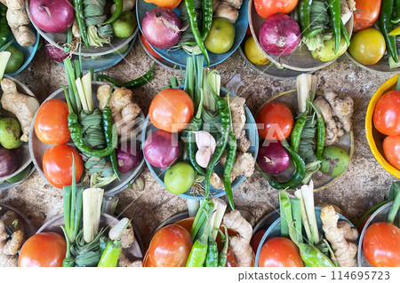 Fresh vegetables at the farmers market, tomatoes, onions, pepper, ginger Fresh vegetables at the farmers market, tomatoes, onions, pepper, ginger 114695723