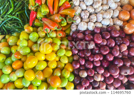 Fresh vegetables at the farmers market, tomatoes, onions, pepper, garlic 114695760