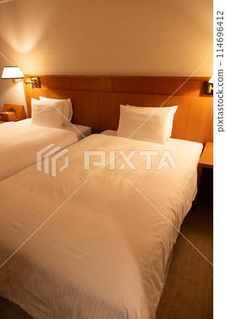 Hotel twin room bed at night 114696412