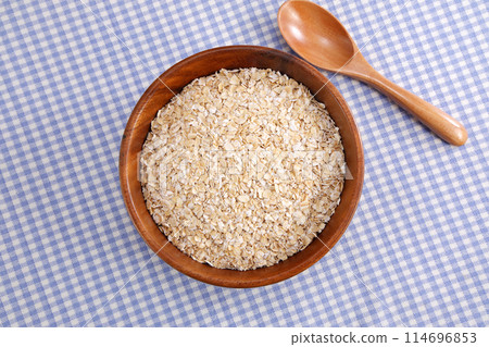 Oatmeal served in a wooden bowl Oatmeal served in a wooden bowl 114696853