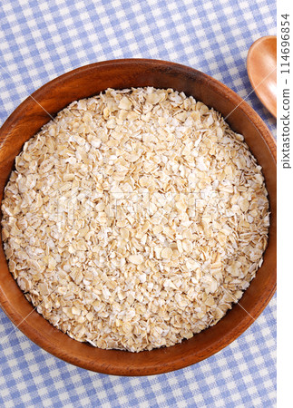 Oatmeal served in a wooden bowl Oatmeal served in a wooden bowl 114696854